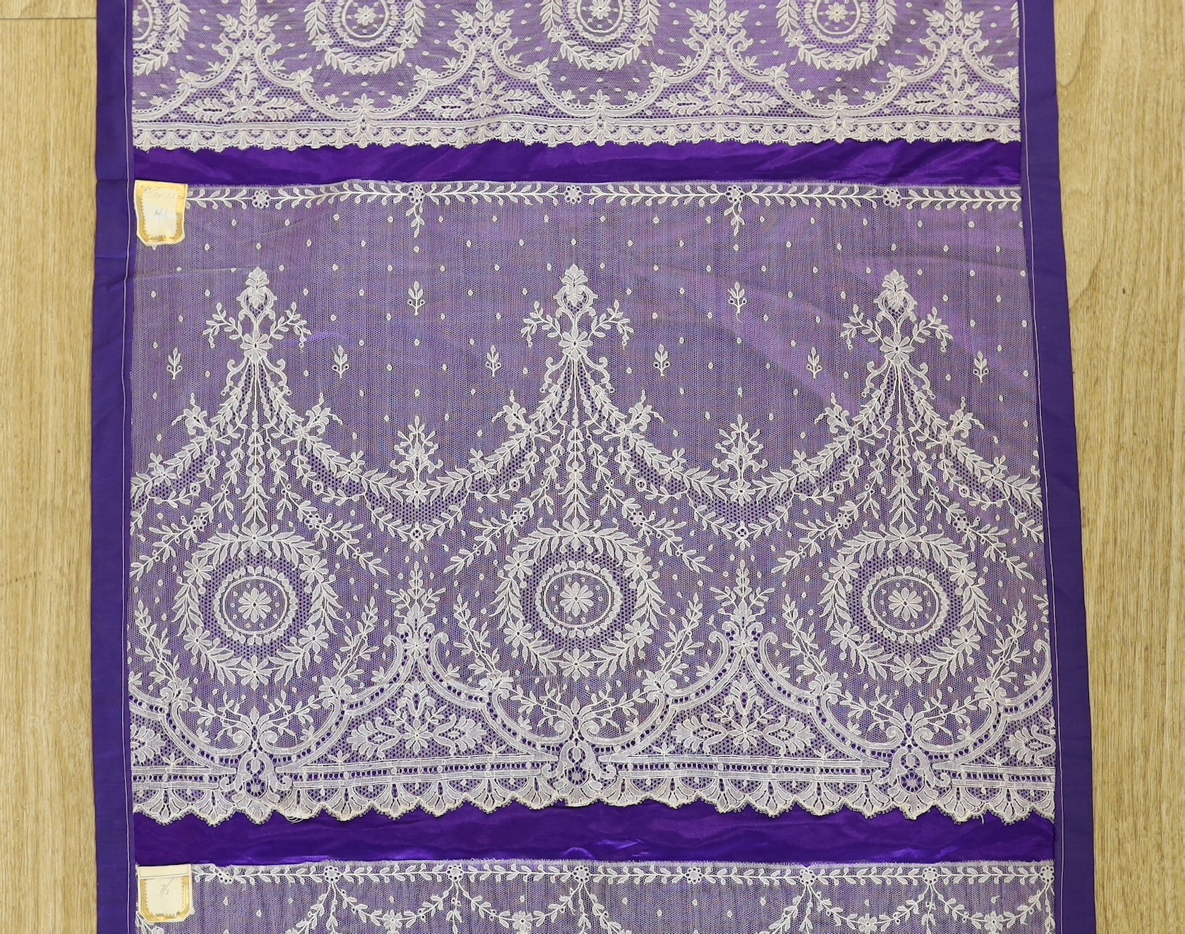 A late 19th, early 20th century retail sample display of various lace designs